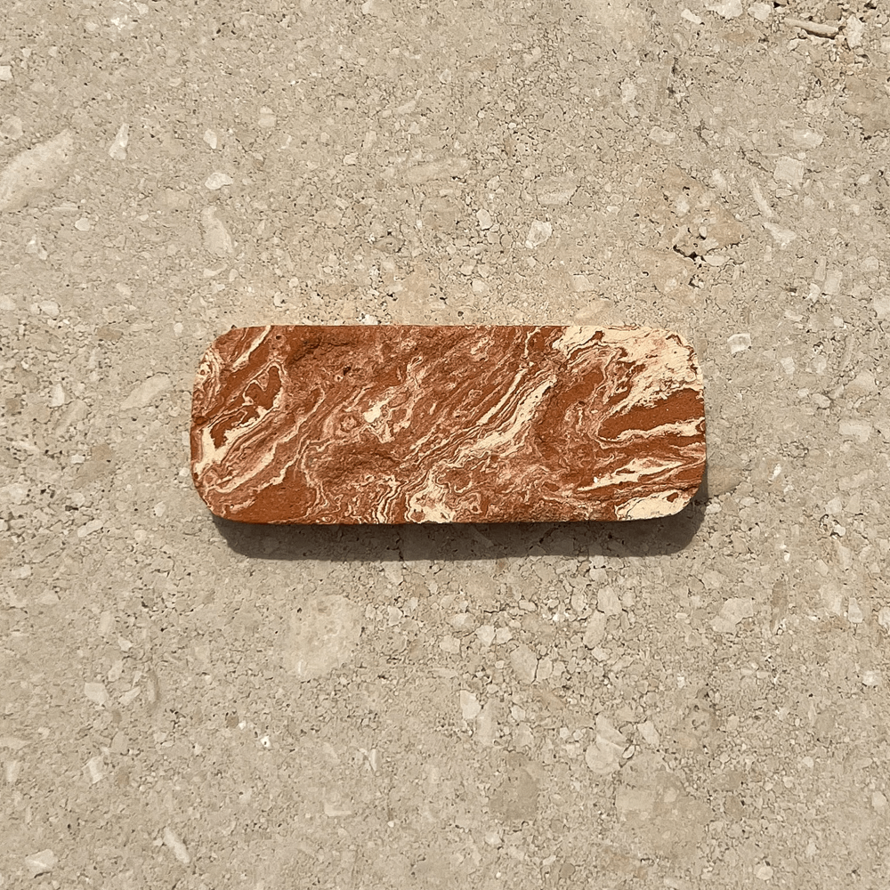 Close-up of handcrafted marbled terracotta diffusion stone by Gallia Rae