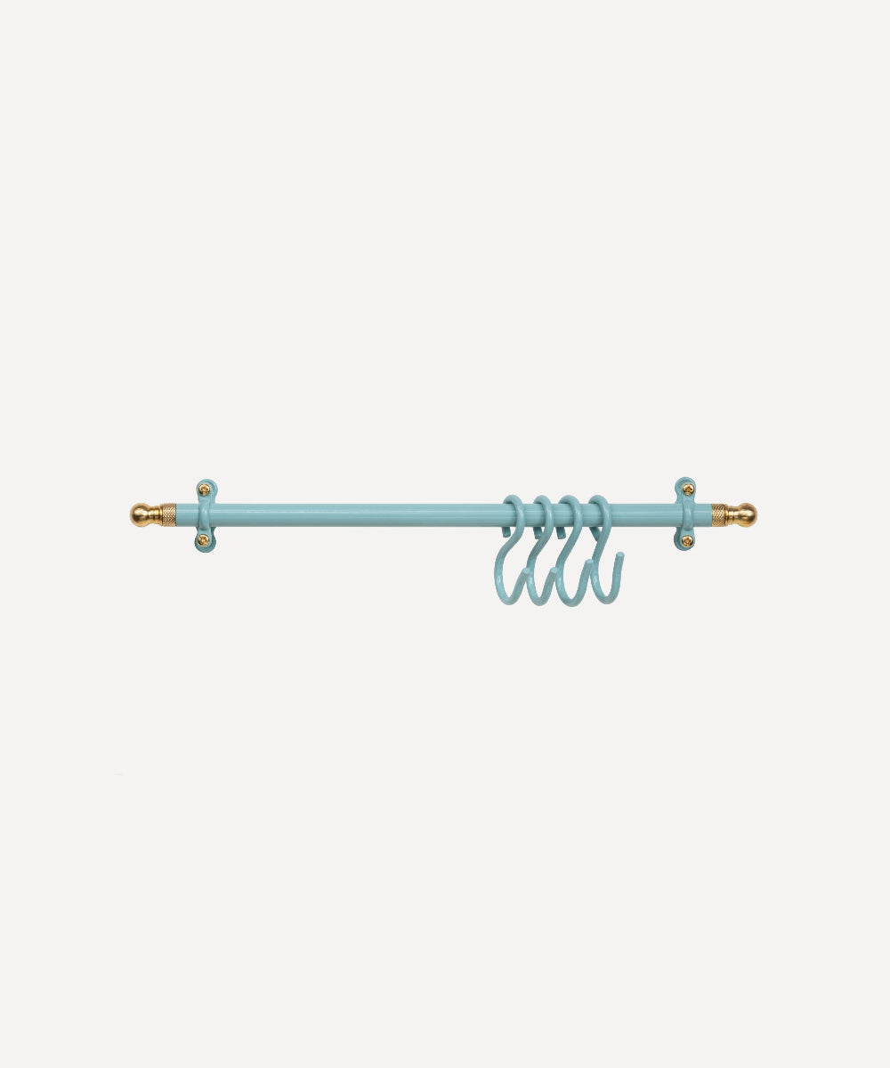 A light turquoise rod with decorative gold-toned finials and four matching hanging rings, shown against a plain light grey background.