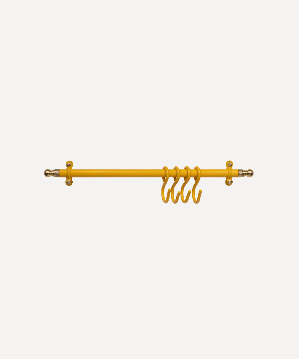Yellow metal kitchen hanging rail with four hanging hooks, shown against a plain light grey background.