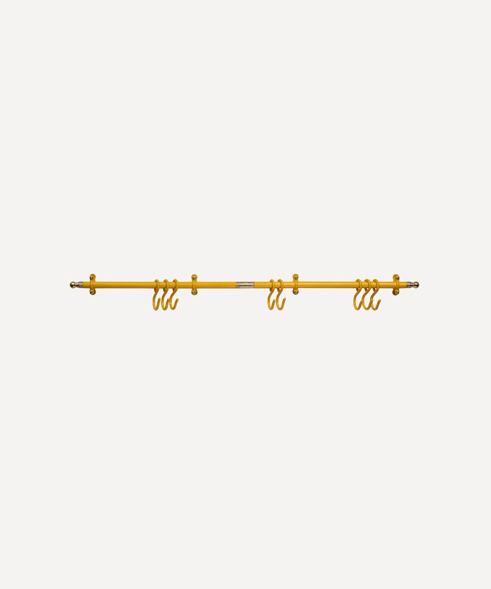 A yellow metal hanging rail bar with multiple hanging hooks, shown against a plain light grey background.