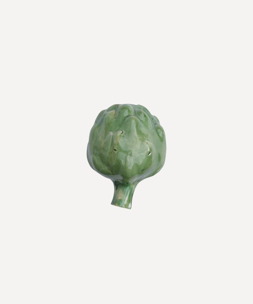 Green ceramic artichoke on a white background