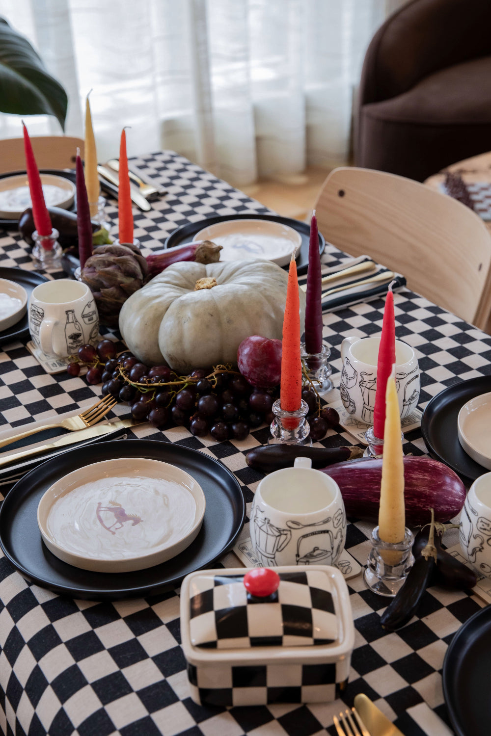 Handmade checkerboard tablecloth styled for a layered dining table