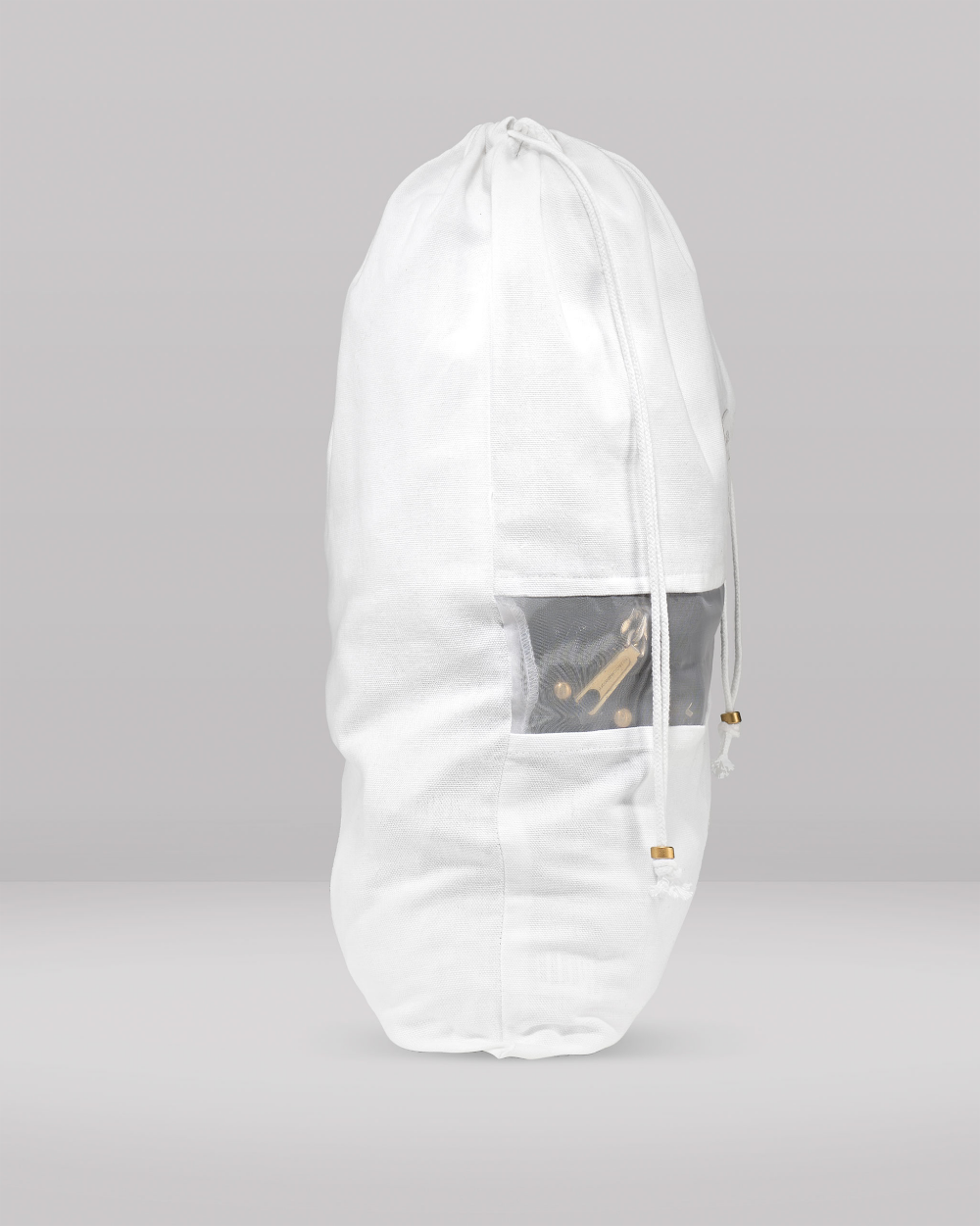 A tall, white drawstring storage bag with a semi-transparent window showing a skateboard inside, set against a neutral gray studio background.