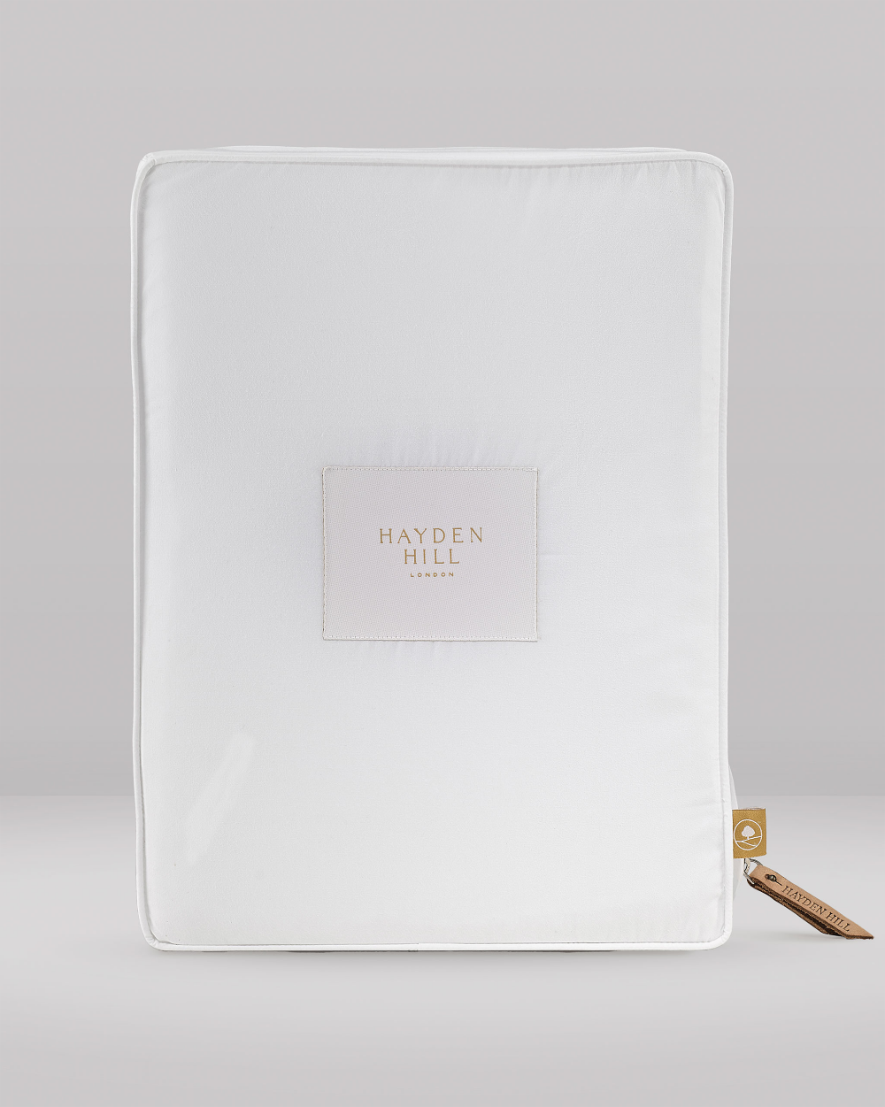 White organic cotton storage bag with 'Hayden Hill' branding on a grey background