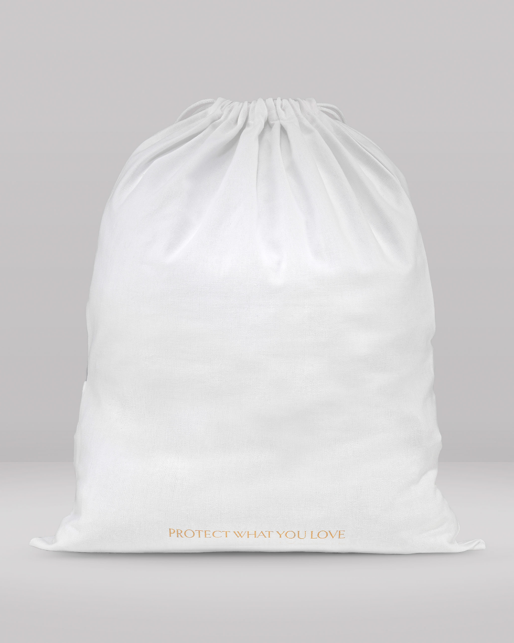 A white drawstring storage bag with gold foil text reading 'PROTECT WHAT YOU LOVE' at the bottom, set against a neutral gray background.