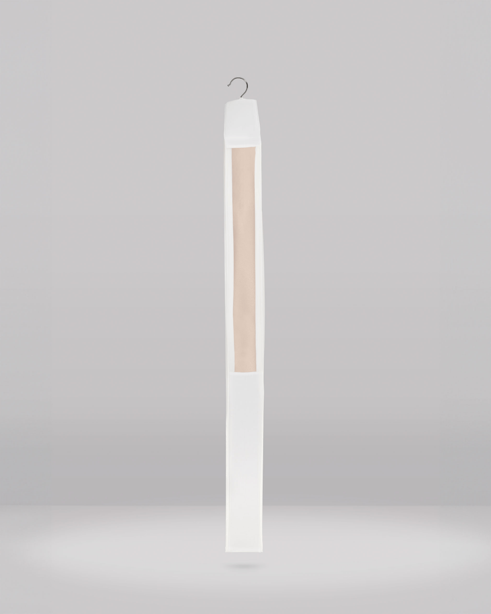 Tall, thin white clothes protector with an organza panel on a grey background