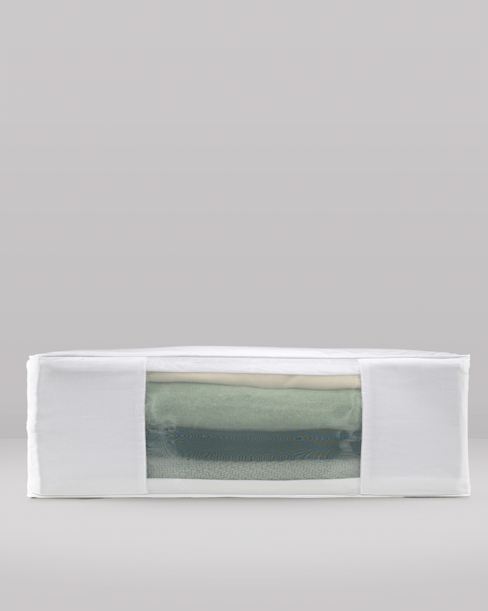 White luxury garmet storage protection with a transparent window displaying a green fabric inside on a grey background