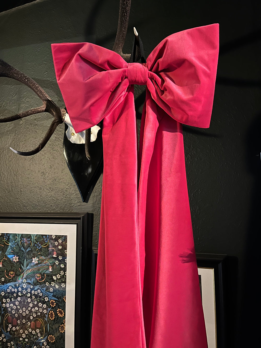 Close view of the hot pink velvet Christmas bow showing its full shape