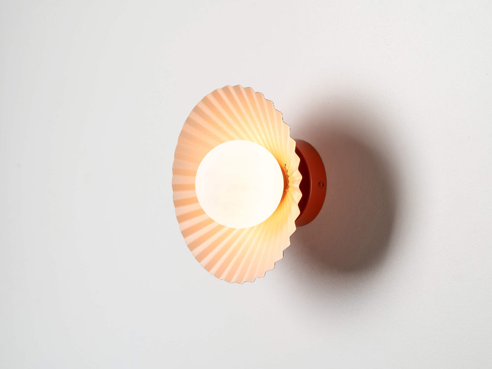 Burnt orange flush pleat wall light designed by Emma Gurner for houseof