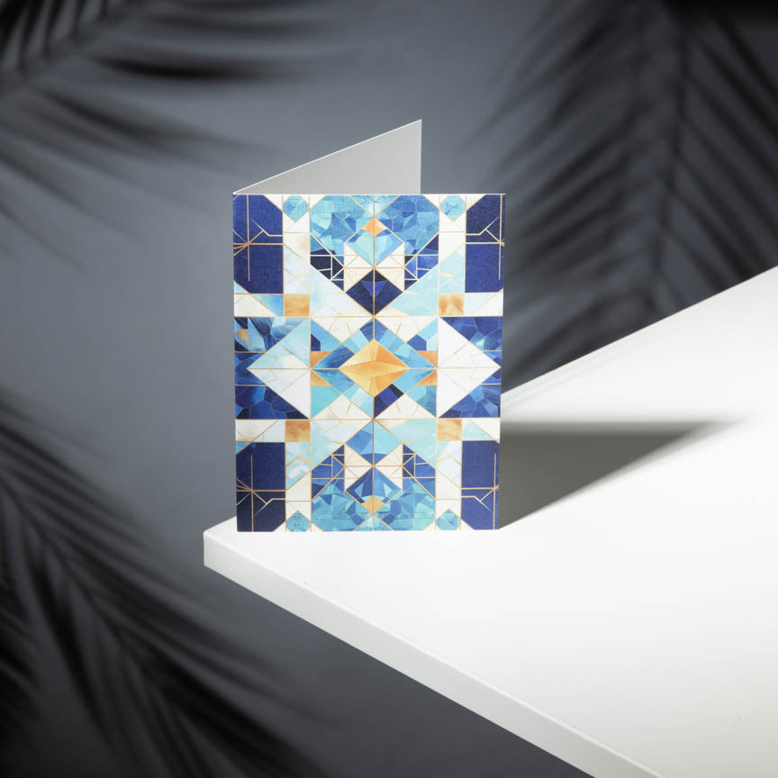Greeting card with geometric pattern on a white surface and dark background