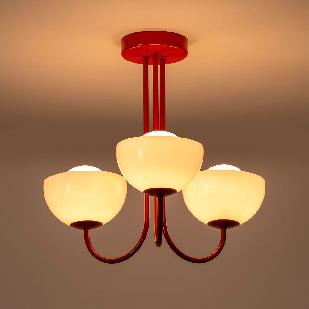 Front view of Jam red flush ceiling light with three dome shades