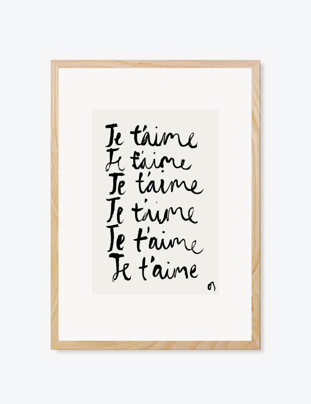 Framed artwork with 'Je t'aime' text on a white background
