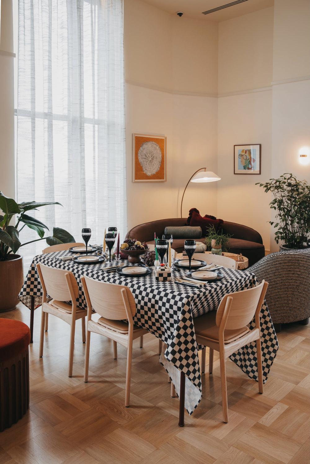 Kika Bespoke black and white checkerboard tablecloth styled on a dressed dining table