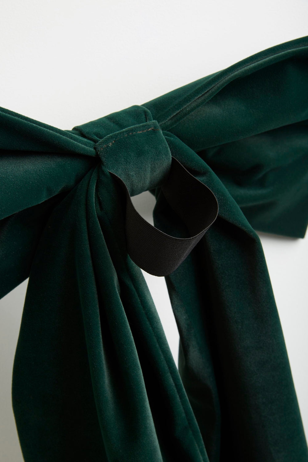 Close-up of the Kika Bespoke forest green velvet Christmas bow