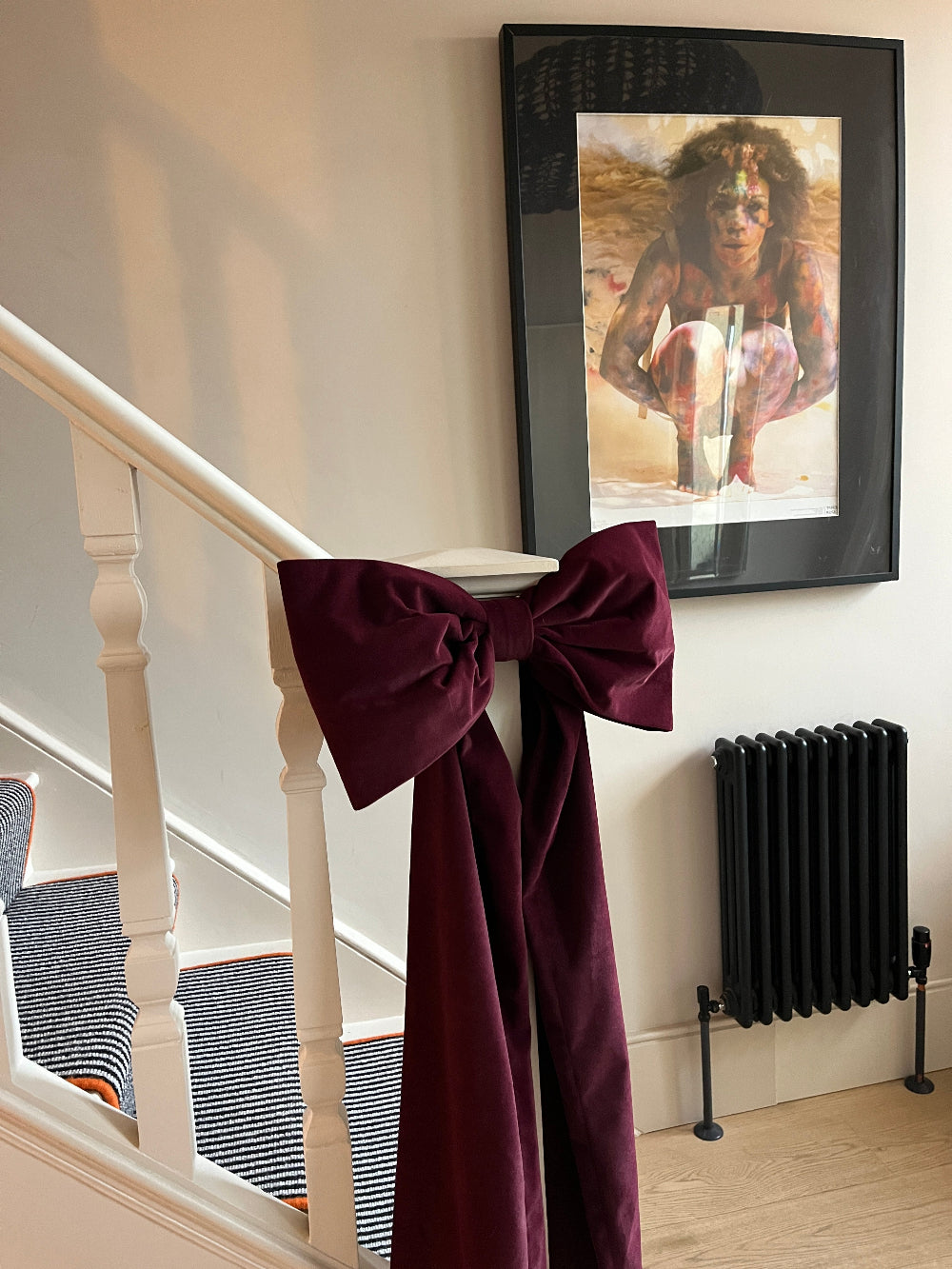 bannister
Kika Bespoke large velvet Christmas bow styled on an indoor bannister