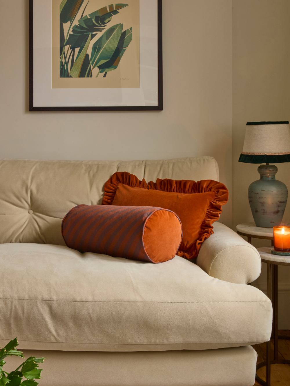 Close view of the rust piping on a Kika Bespoke striped bolster cushion
