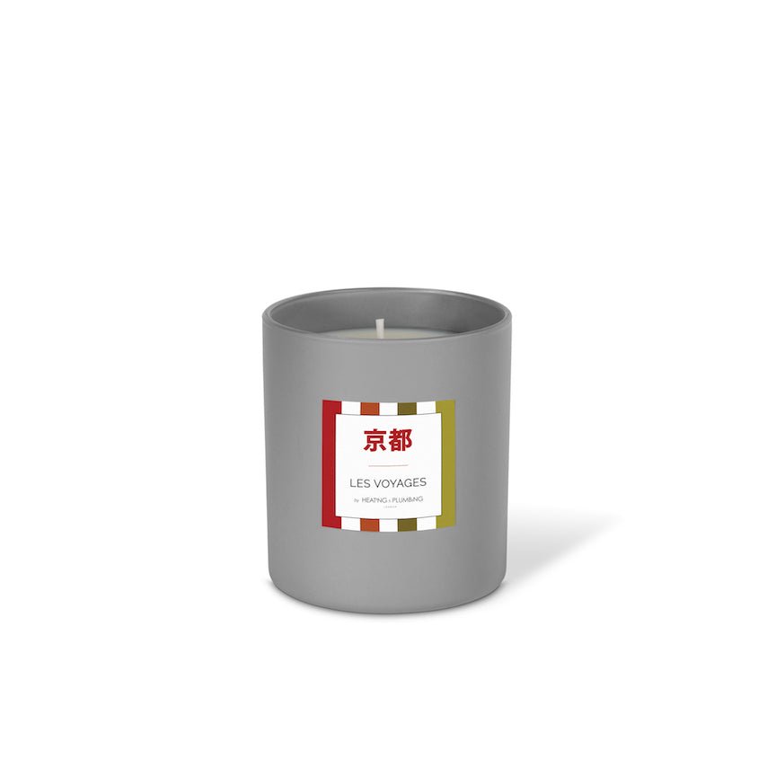 Grey candle with a label on a white background