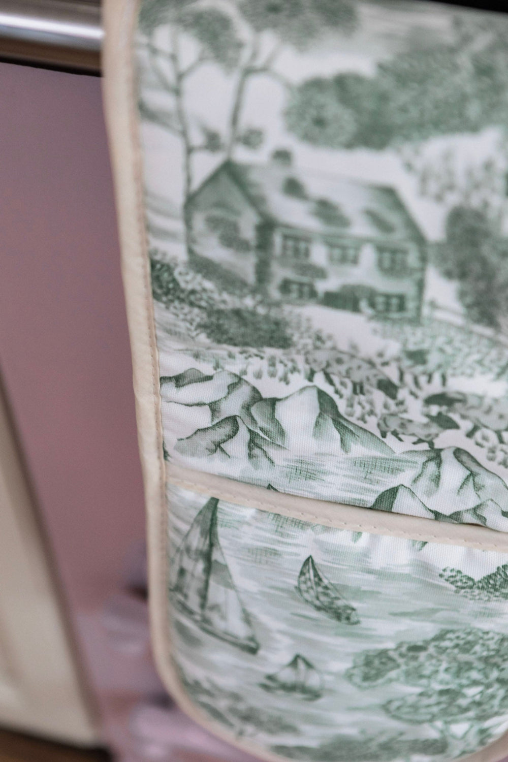 Close-up of a Lake District illustration oven mitt.