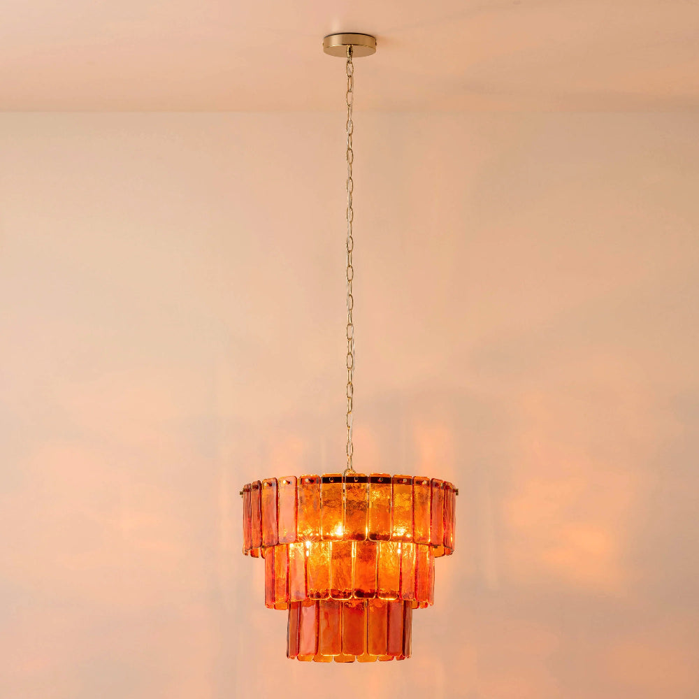 Large amber chandelier suspended from a high ceiling