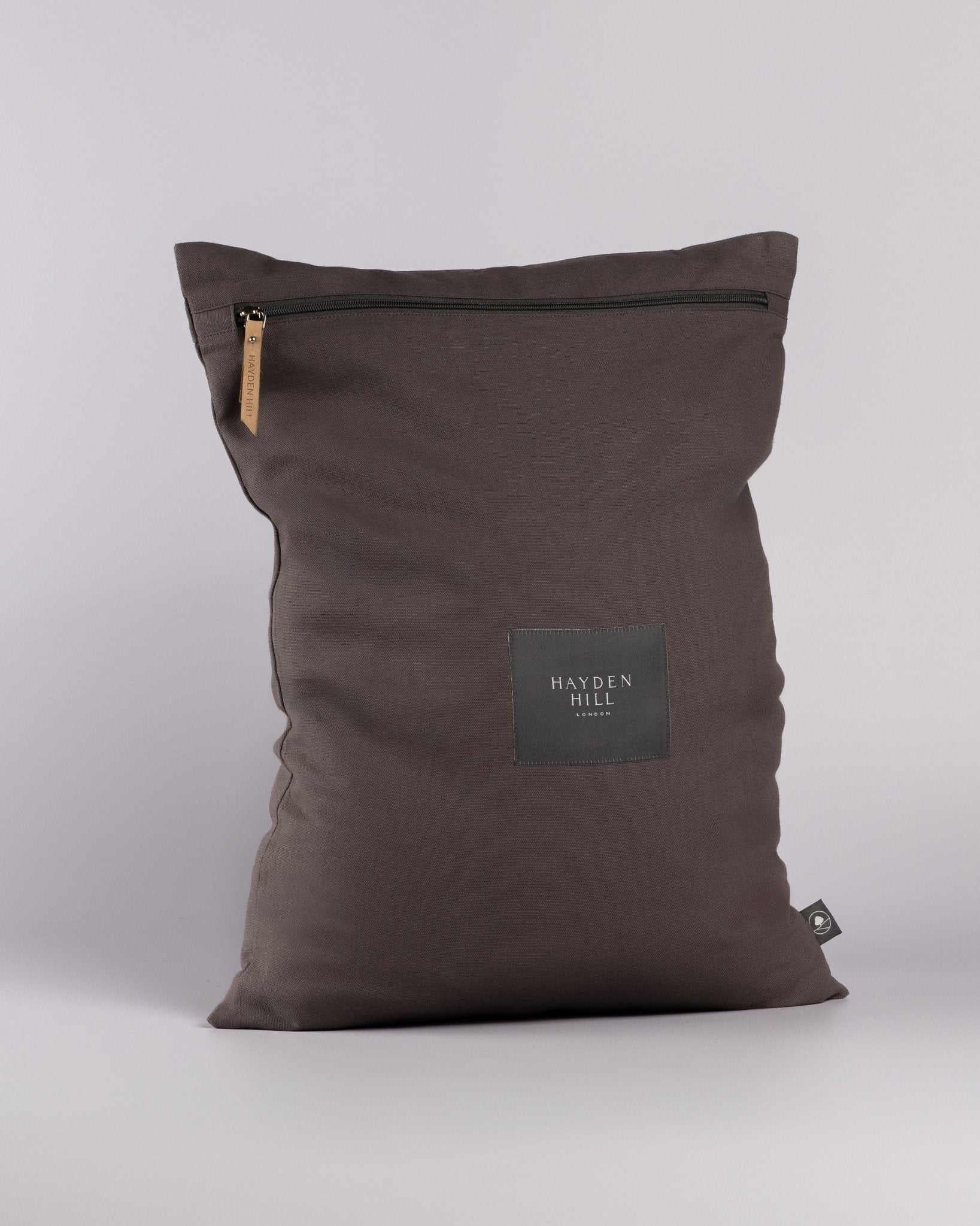 Charcoal Grey dirty clothes bag with a visible brand label on a light grey background