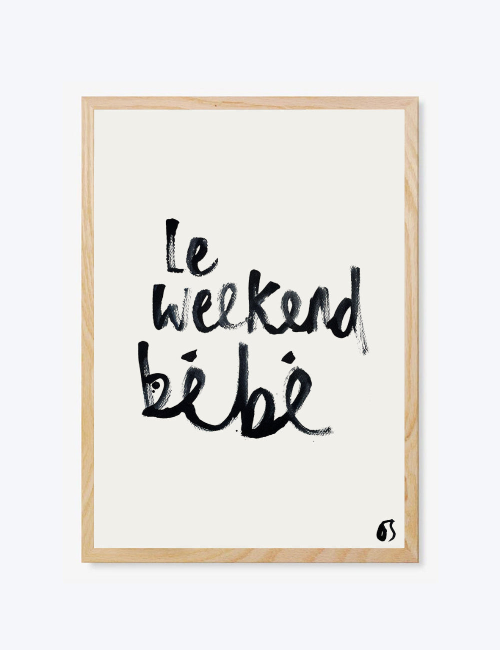 Framed artwork with 'Le weekend bébé' text on a white background