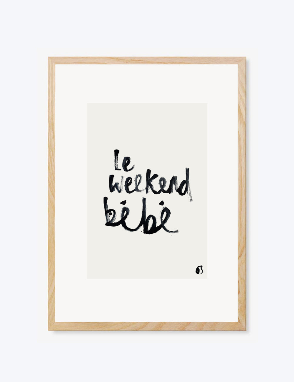 Framed artwork with 'Le weekend bébé' text on a white background