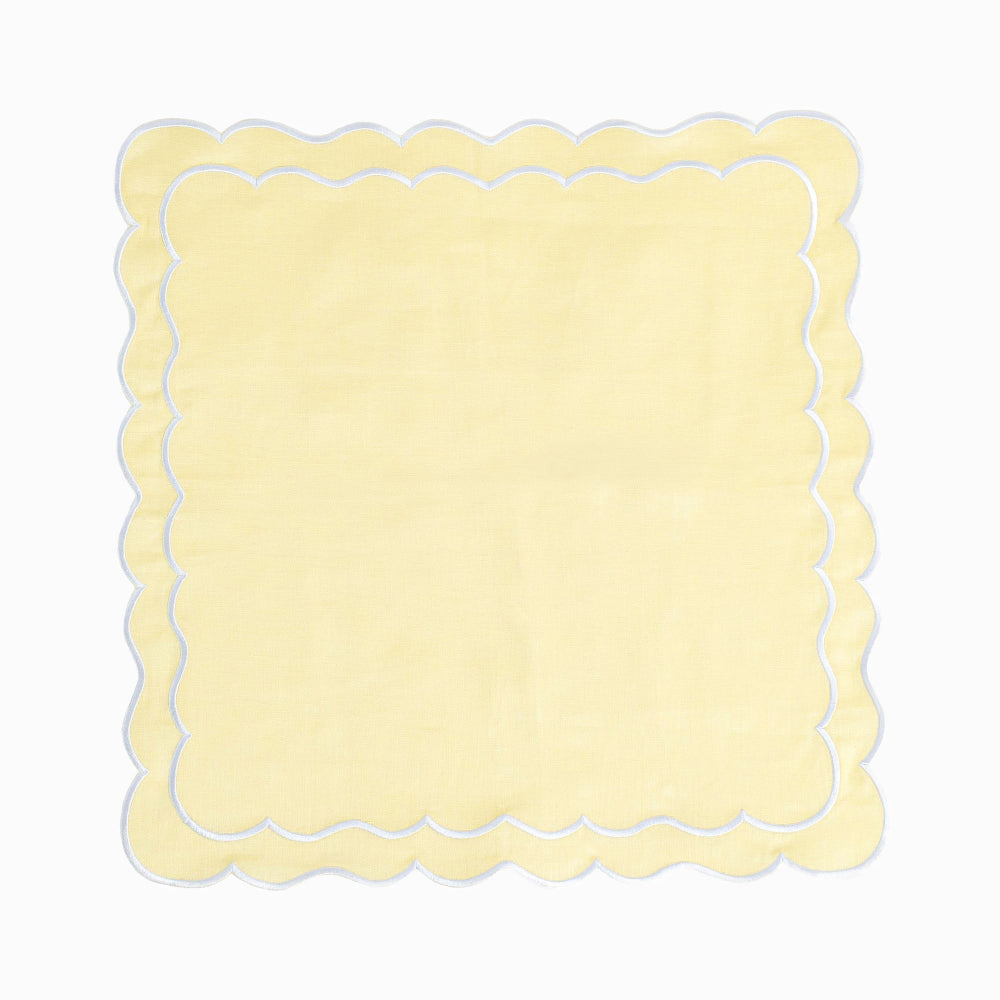 Yellow scalloped border edge square napkin on a white background