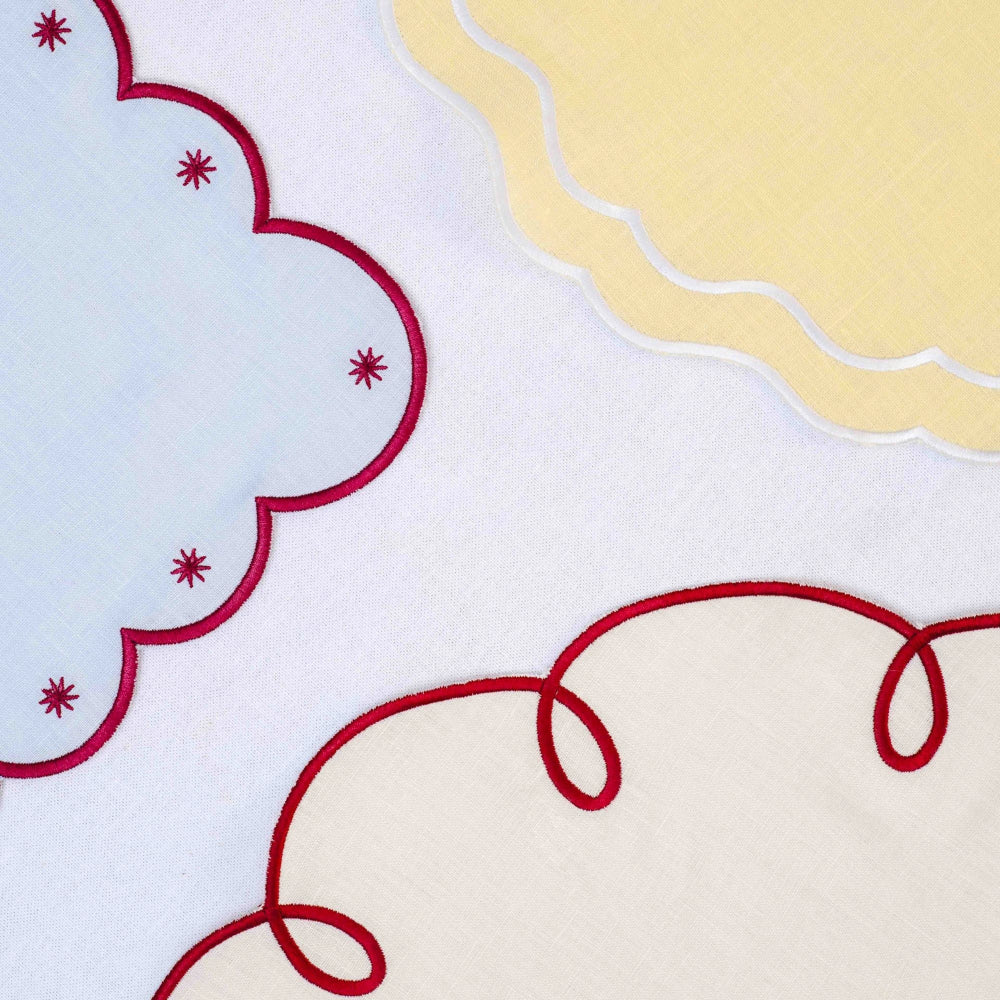 Close-up of buttermilk yellow scalloped edge napkin