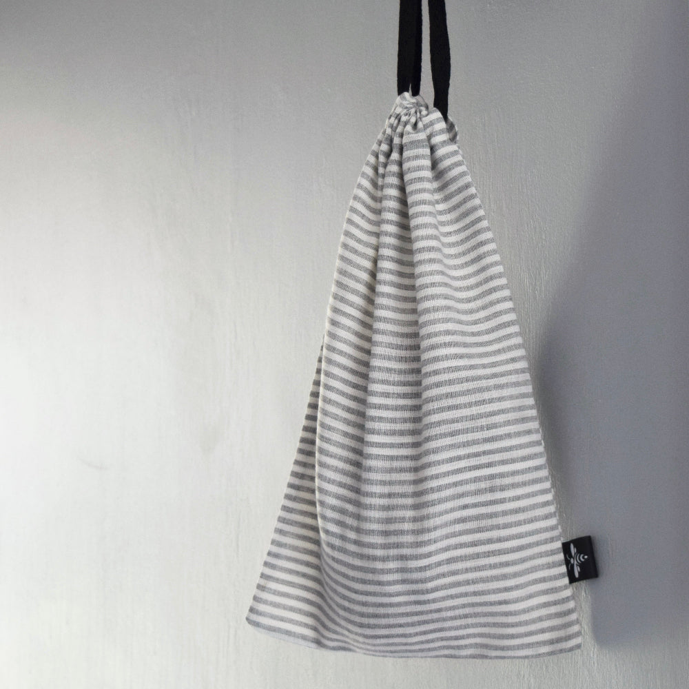 Striped drawstring sourdough bag on a plain background