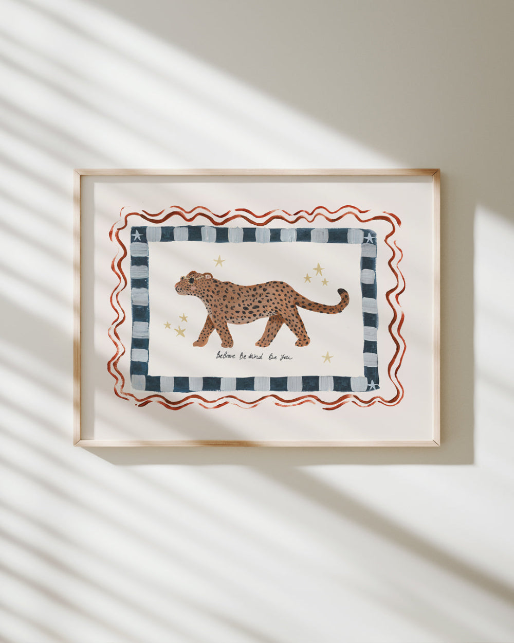 Framed artwork with a leopard illustration on a striped background