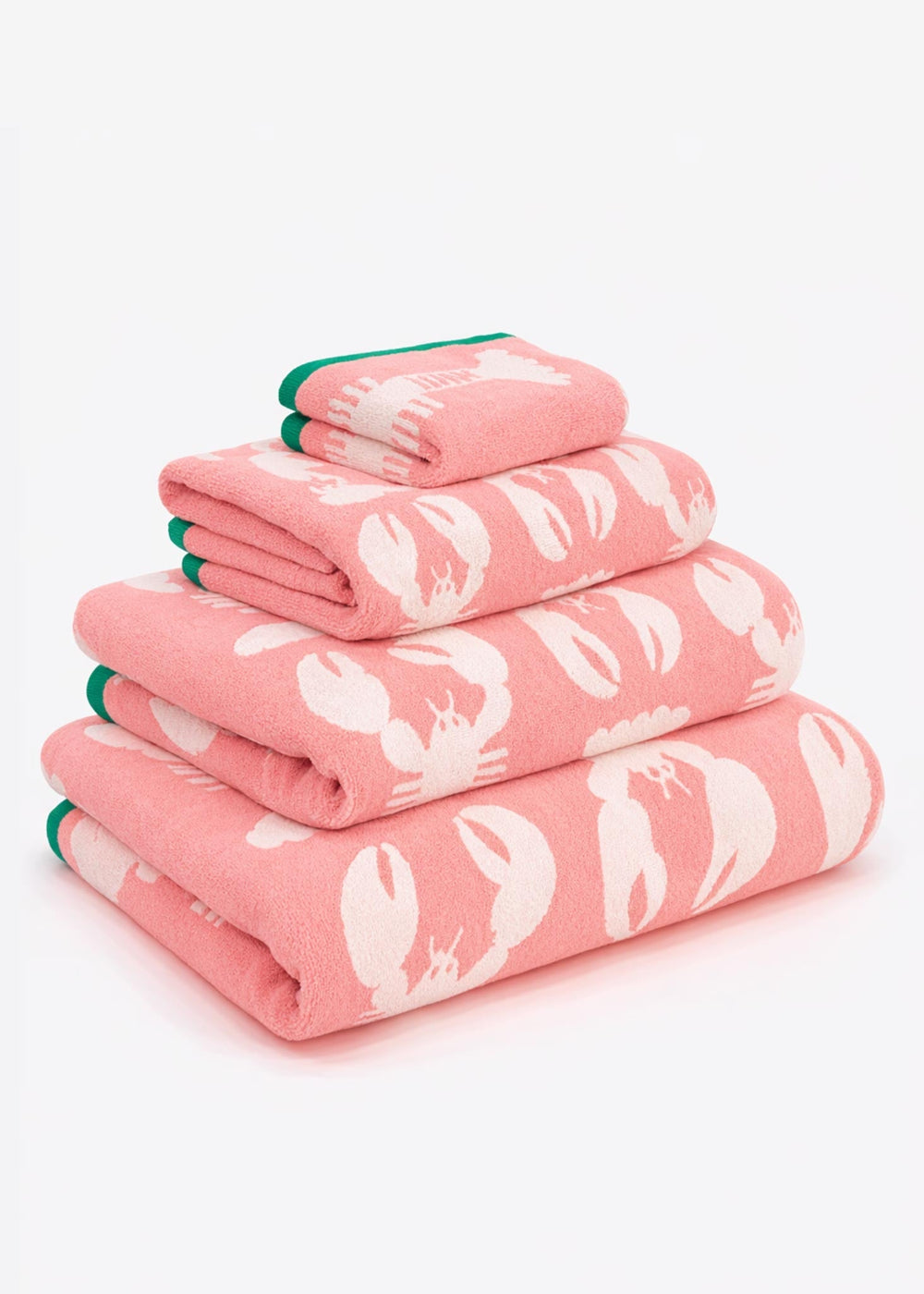 Stack of pink towels with white lobster patterns on a white background