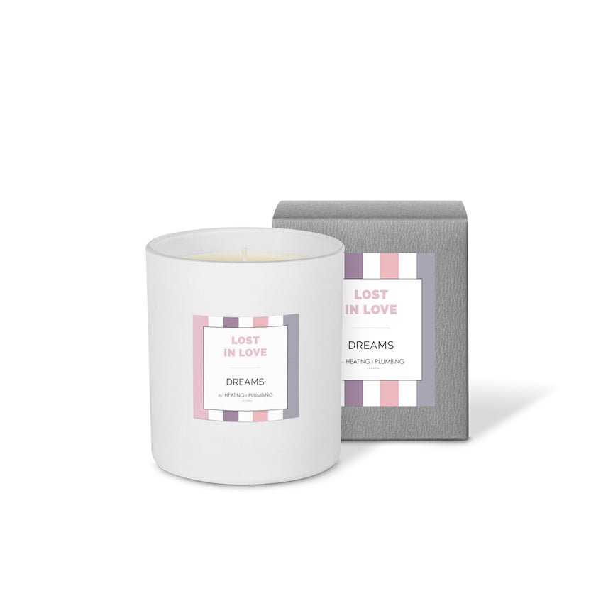 White candle with 'Lost in Love' packaging on a white background