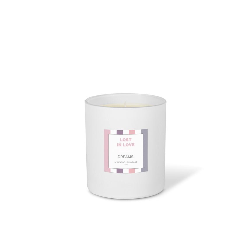 White candle with a label on a white background