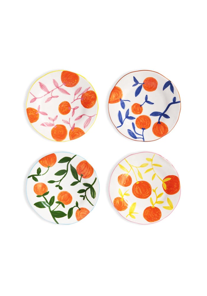 Four decorative plates with orange and floral patterns on a white background