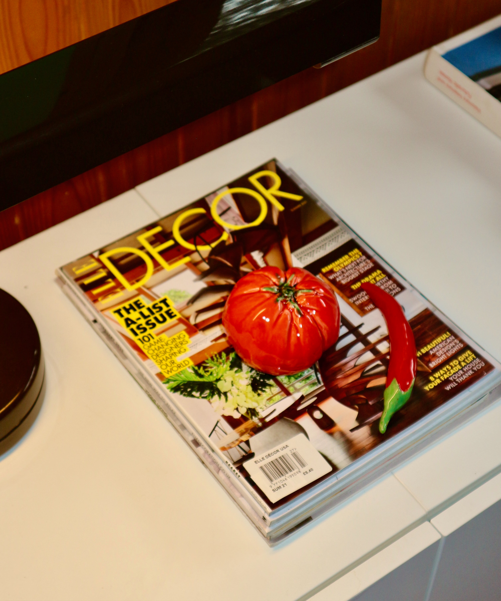 Decor magazine with a tomato on the cover on a kitchen counter