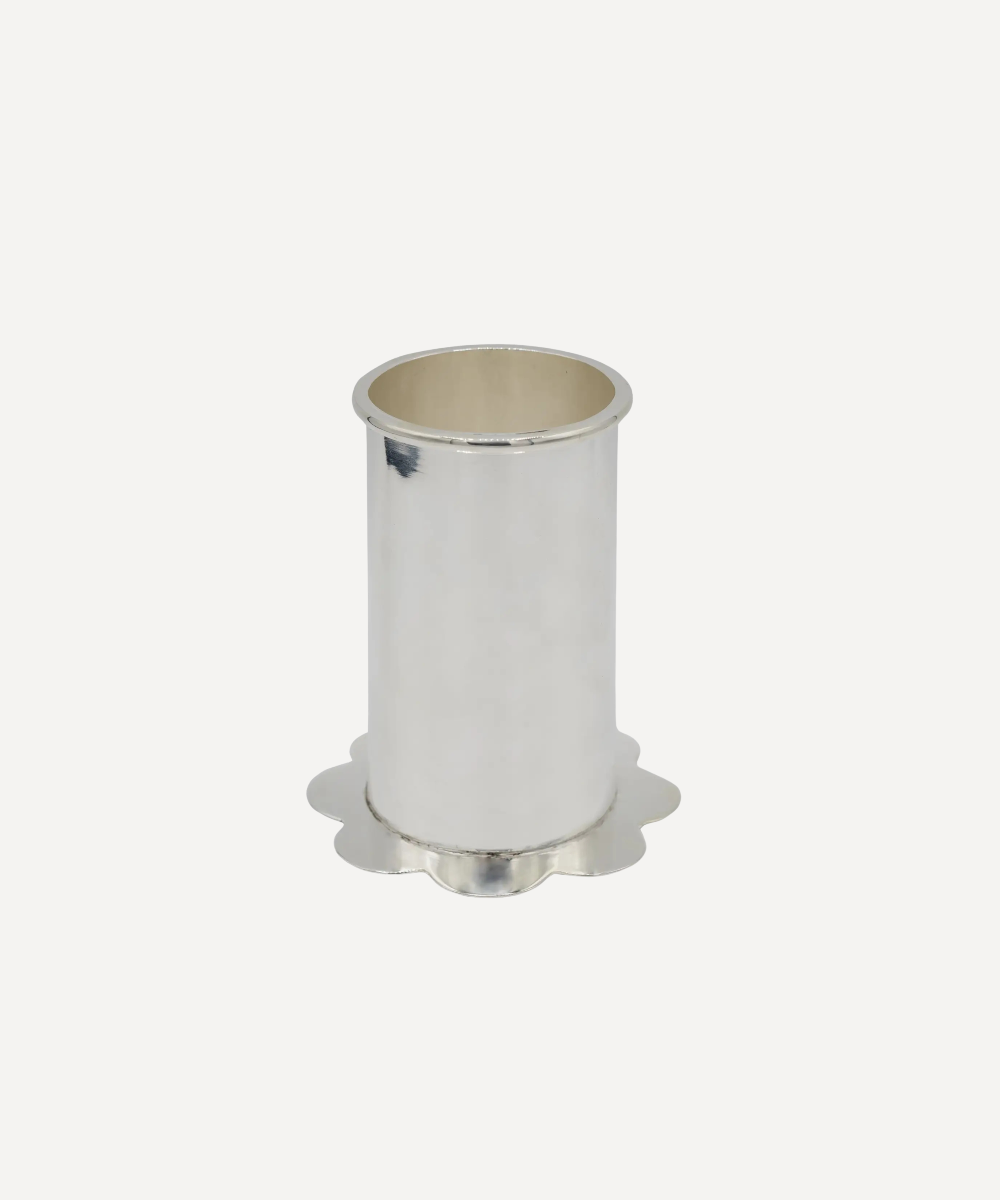 Silver cylindrical object on a white background