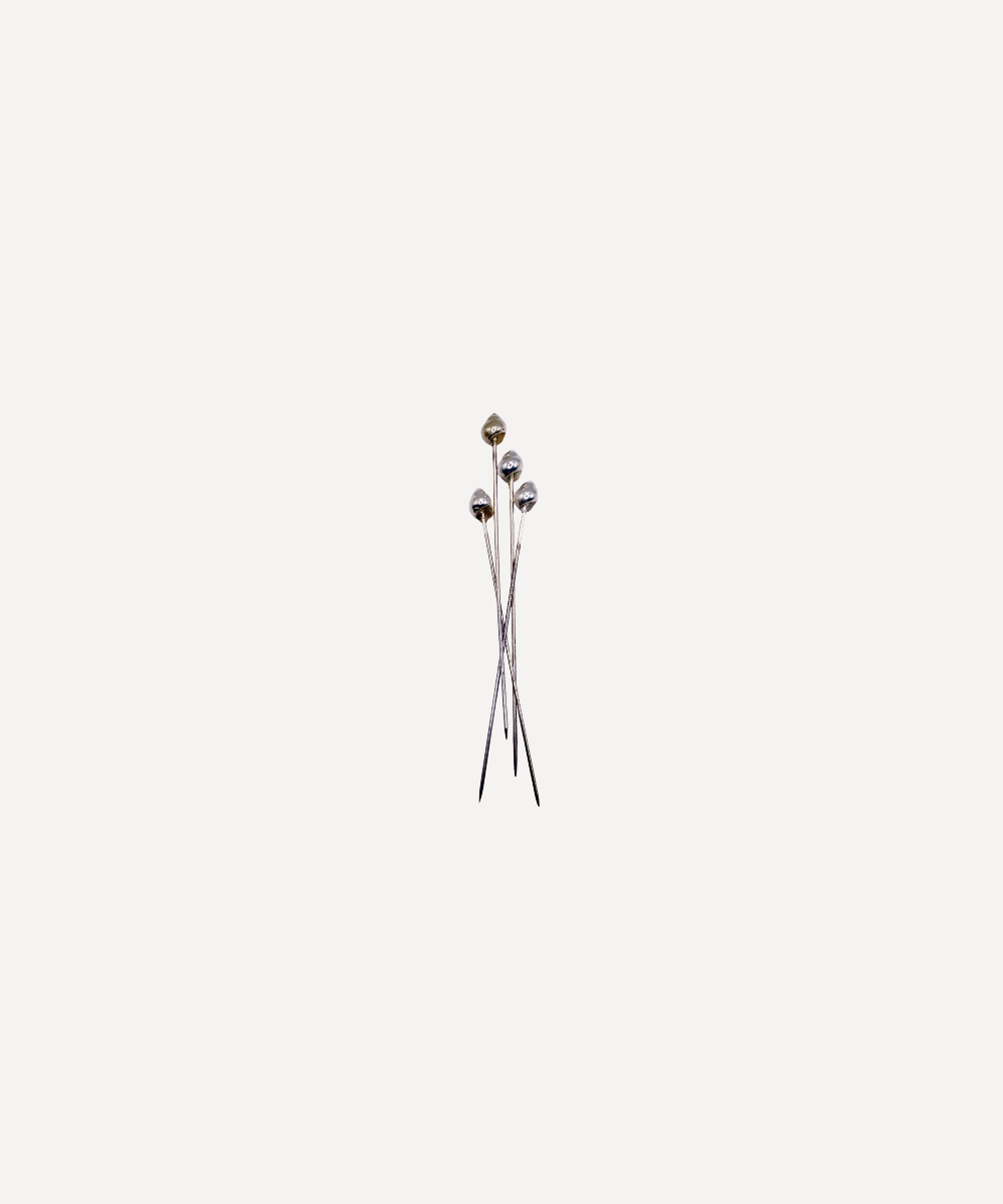 Marla primrose shell cocktail sticks grouped on a white background