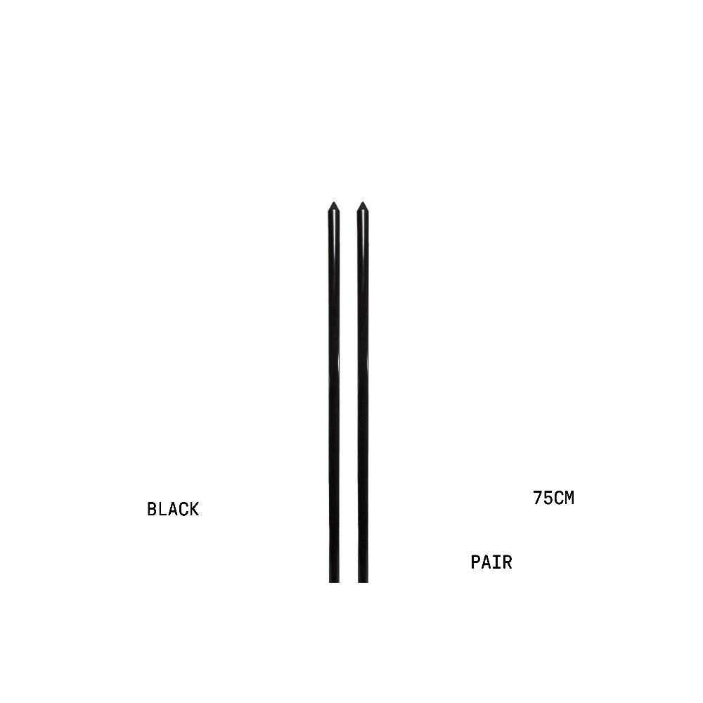 Two black candles with measurements on a white background