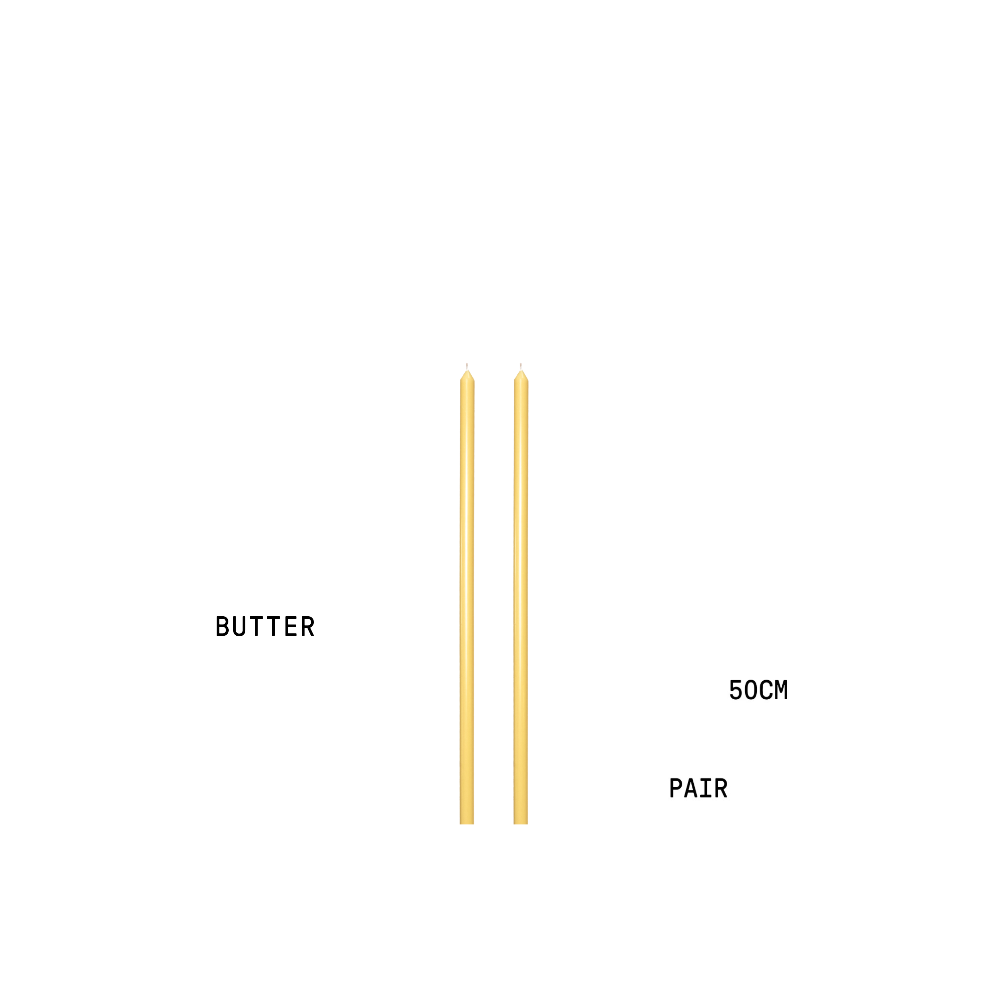 Two tapered candles labelled 'BUTTER' and 'PAIR' with measurement text on a white background.