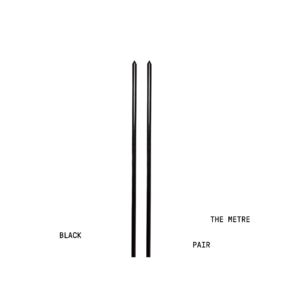 Two black metre long candles for tablescaping halloween or modern interiors.