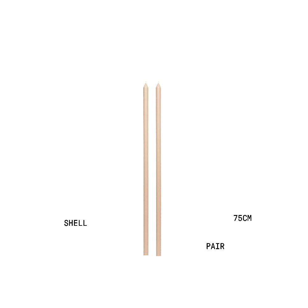 Two shell coloured tapered candles with measurements on a white background