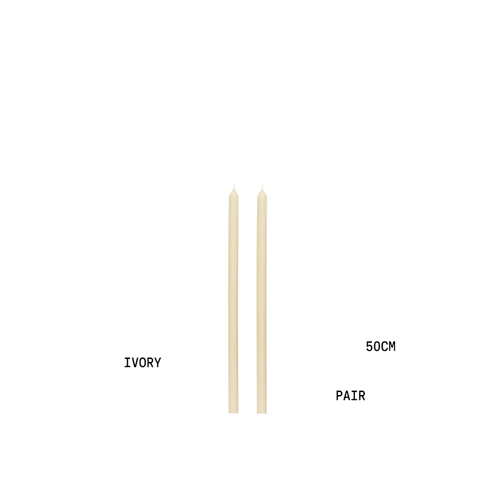 Two ivory candles with measurements on a white background