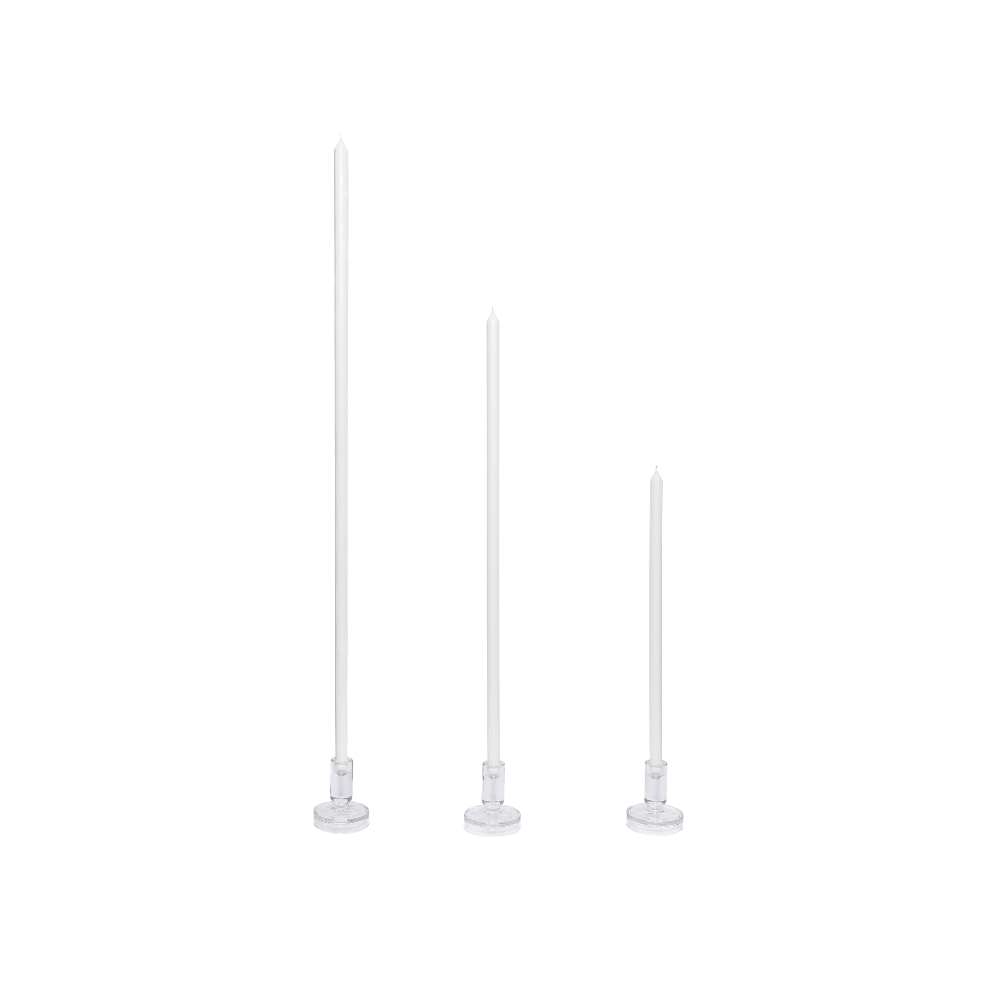 Three white candles on a white background