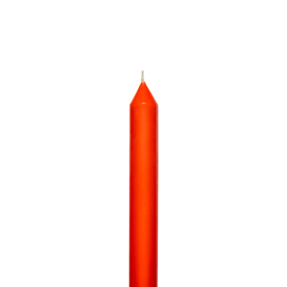 Tomato coloured candle on a white background