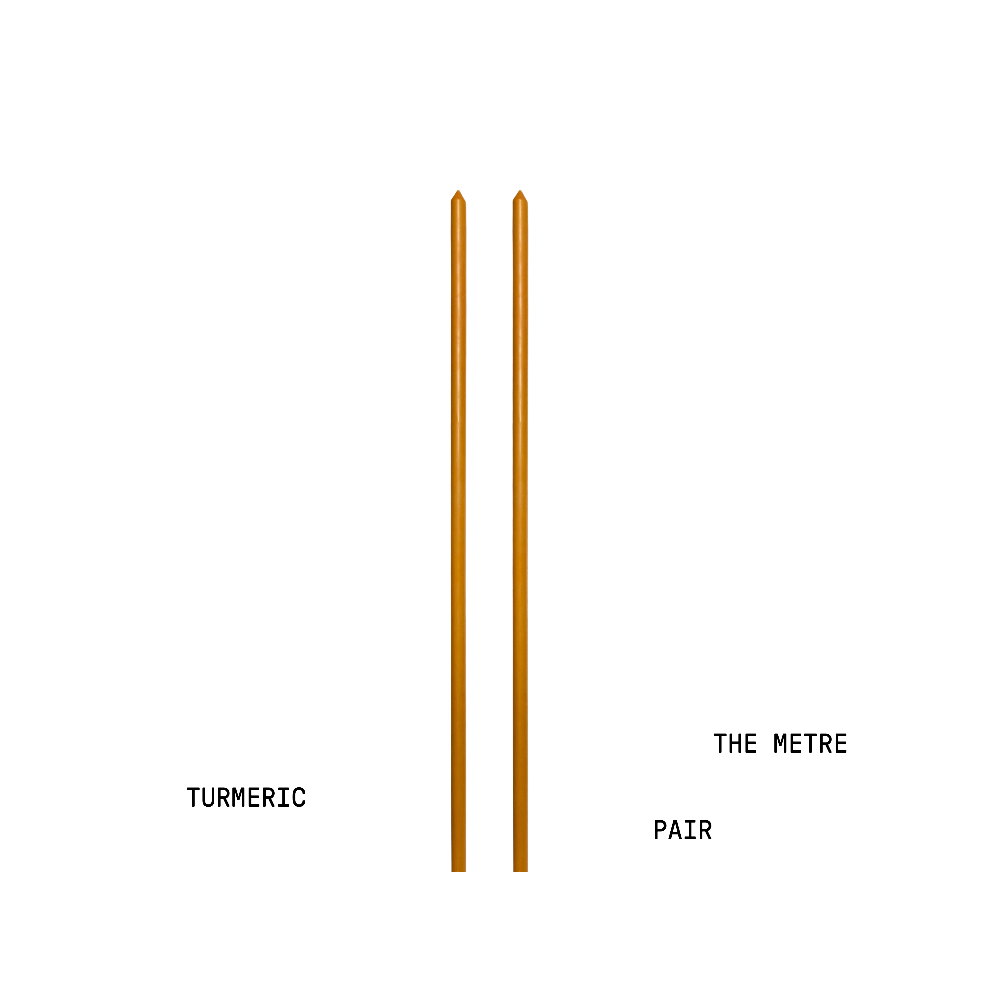 Two metre long candles labelled 'Turmeric' and 'The Metre Pair' on a white background