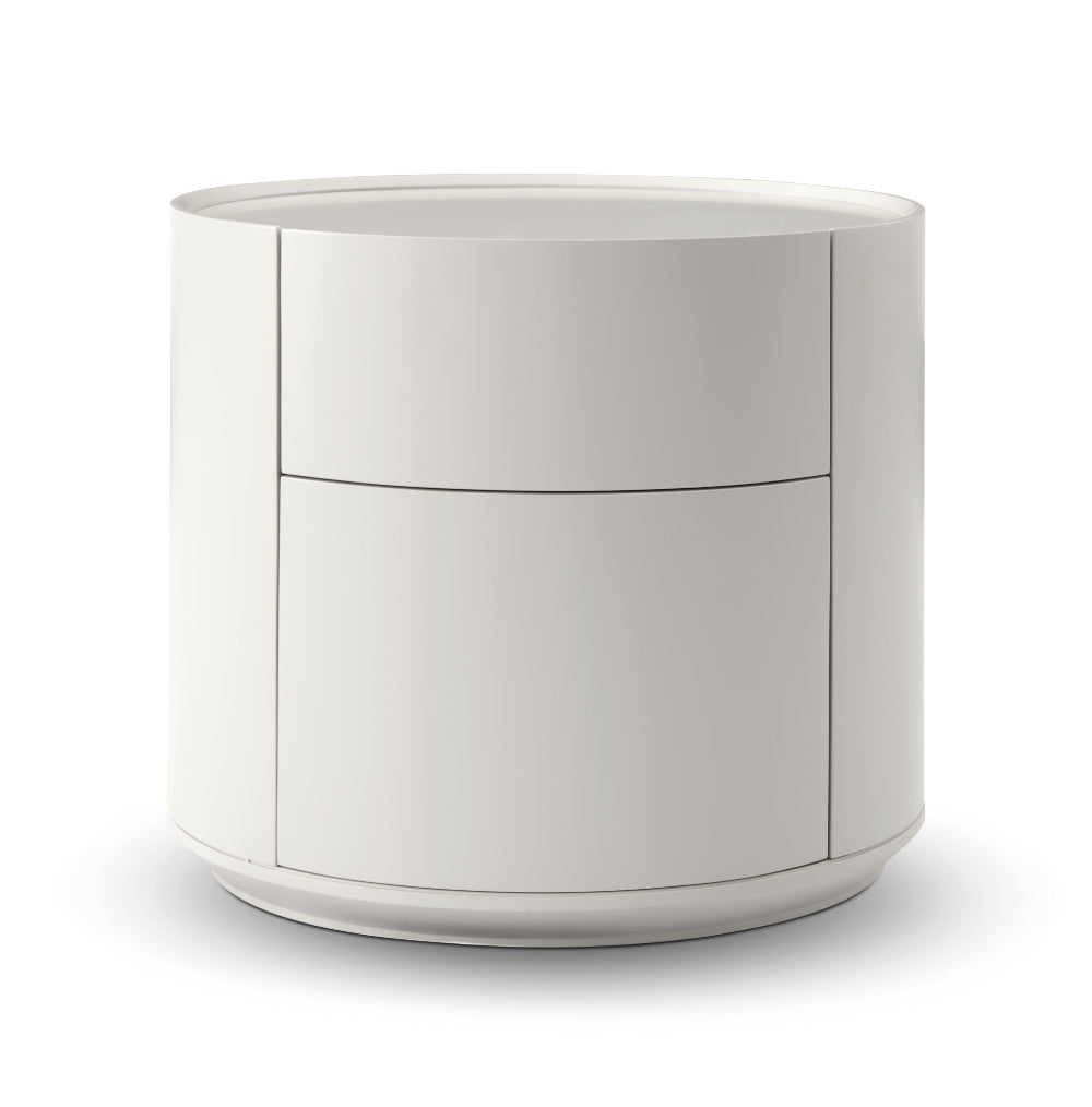 Matte beige bedside table by tommy franks with drawers on a white background