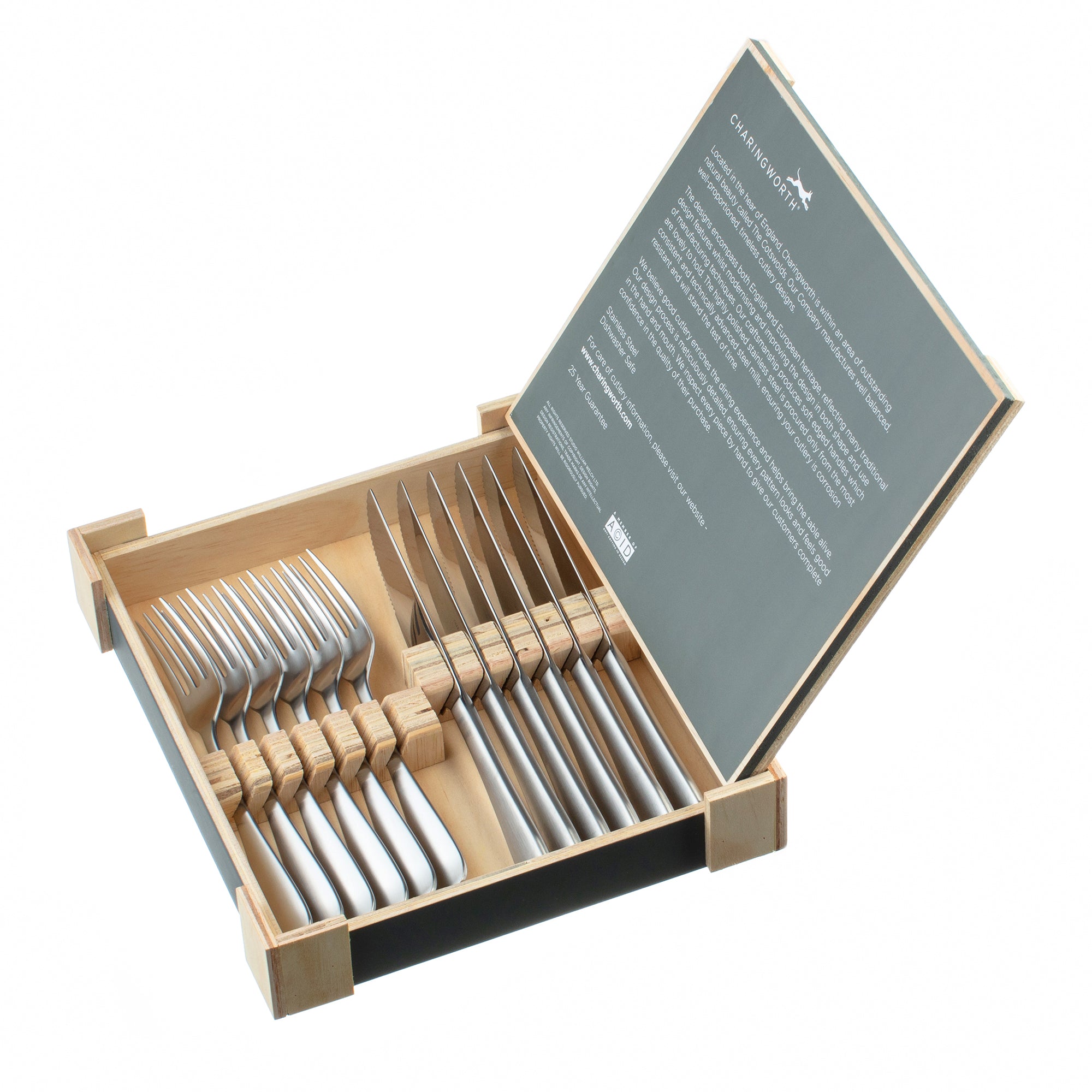 Set of silver forks in a wooden box with a green label on a white background