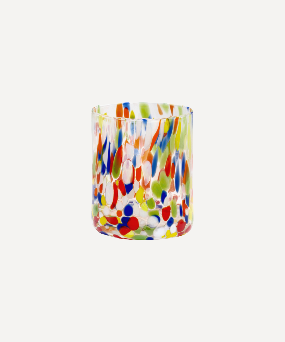 Colourful glass tumbler with a multicolour pattern on a white background