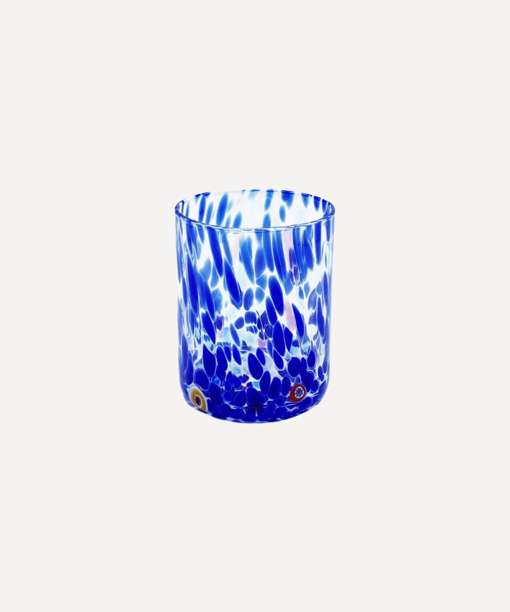 Blue and white patterned murano glass tumbler on a white background