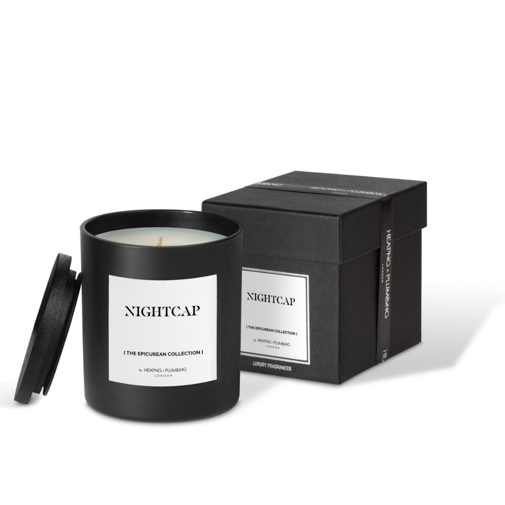 Black candle with 'NIGHTCAP' label and matching packaging on a white background